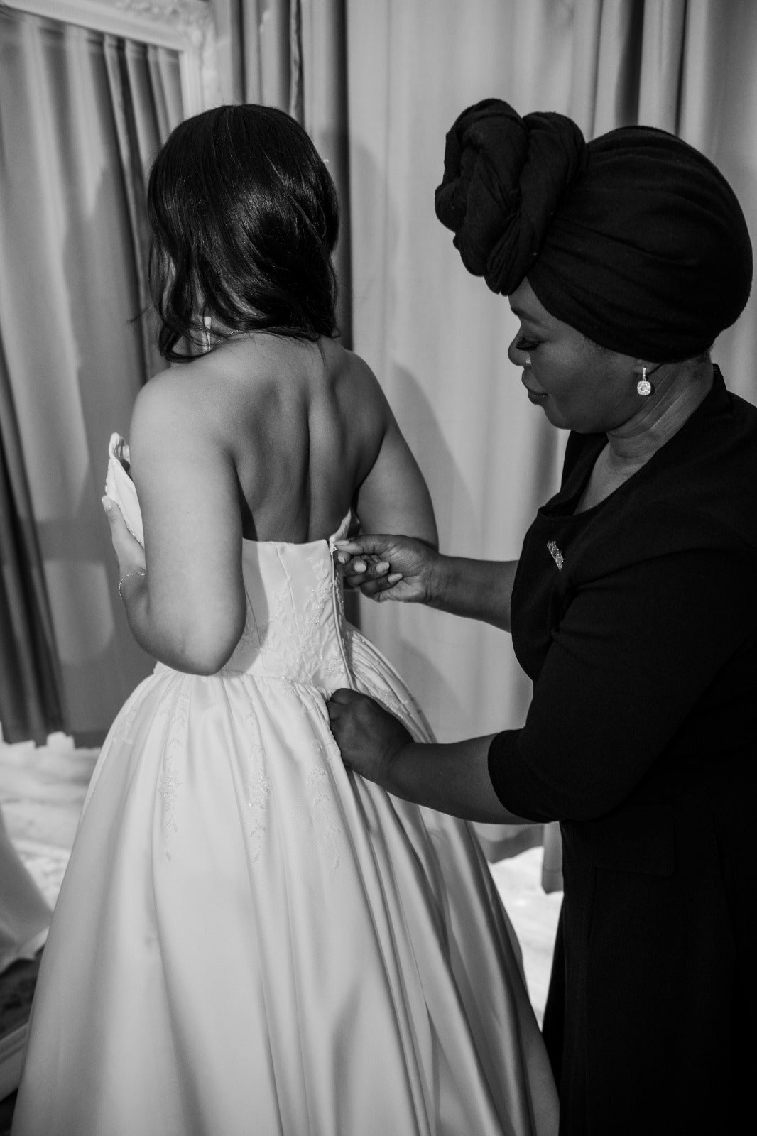 Silver at work dressing a bride in a bridal suite, ready to reveal